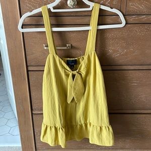 Tank- color is mustard yellow ish with a hint more of green undertone